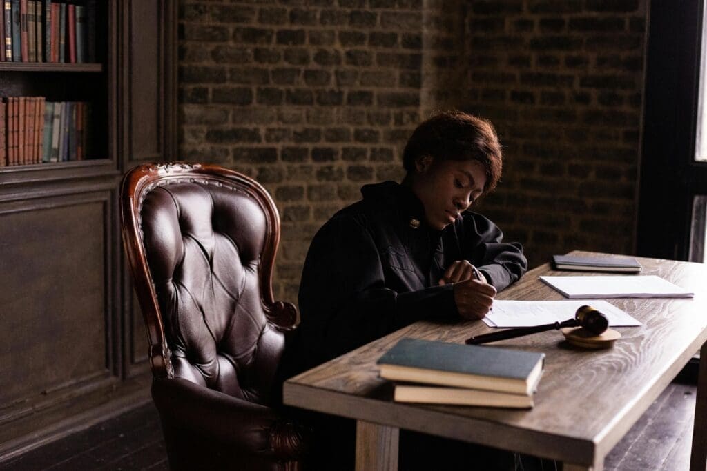 Attorney filling out legal paperwork for Tyndall client